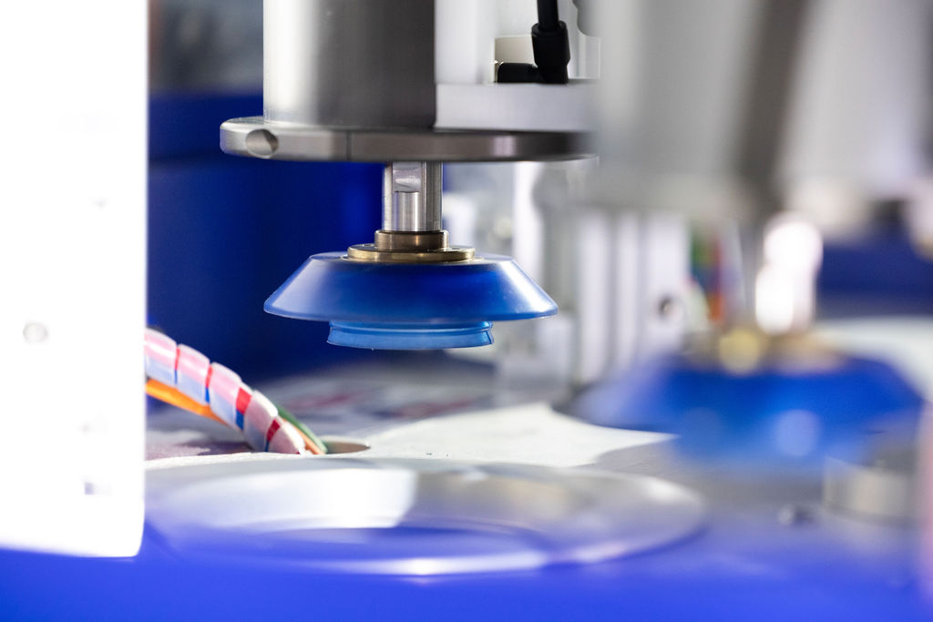 Close up of the 54R machines lens coating system